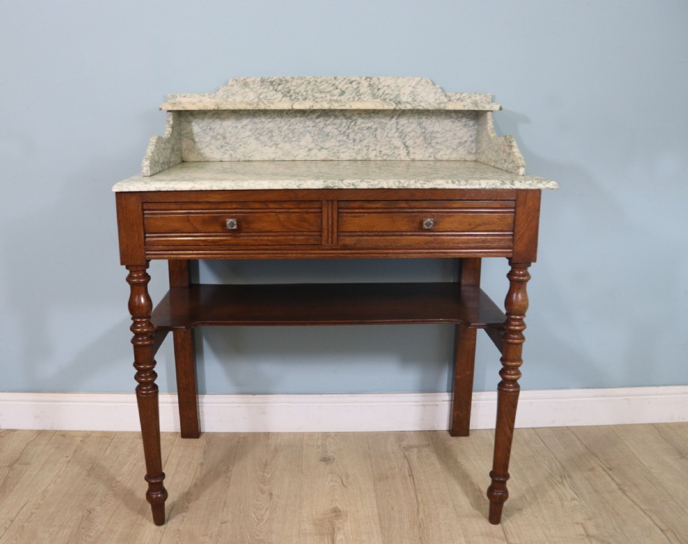 Late Victorian oak and walnut framed marble top washstand 