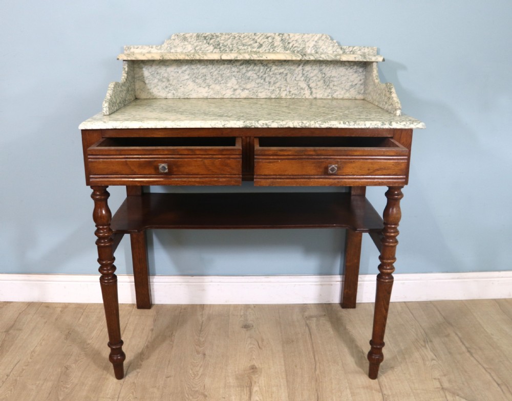Late Victorian oak and walnut framed marble top washstand  View II