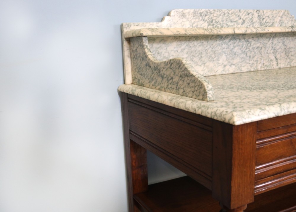 Late Victorian oak and walnut framed marble top washstand  View X
