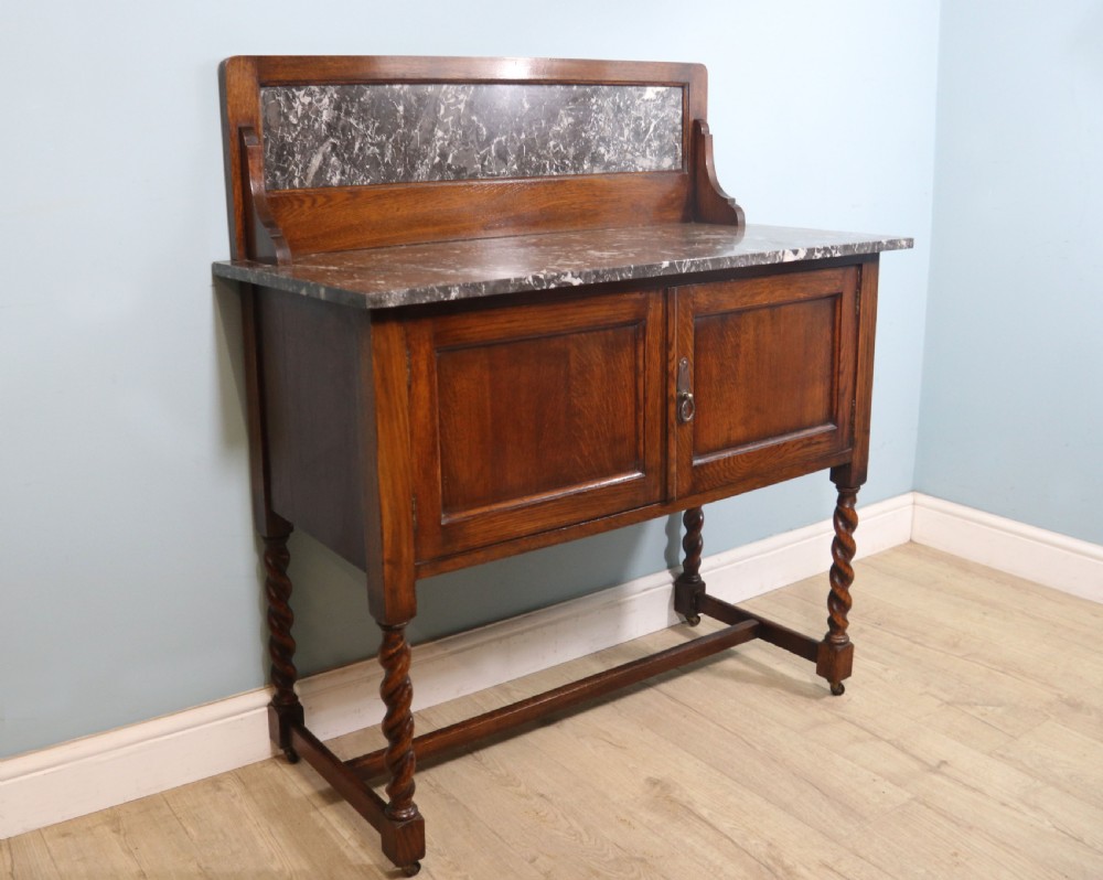 A lovely early 20th Century marble topped oak washstand. View III