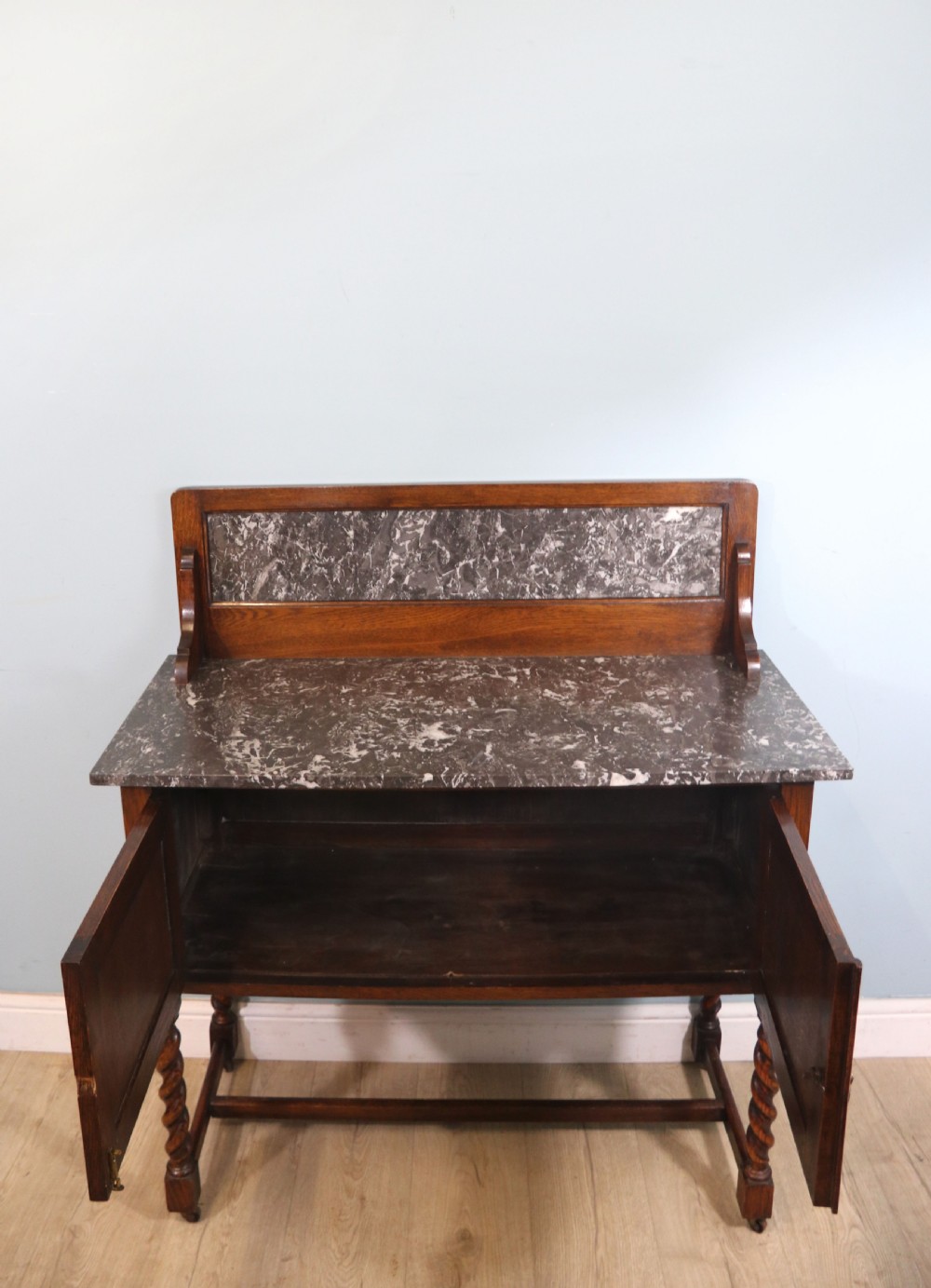 A lovely early 20th Century marble topped oak washstand. View VI
