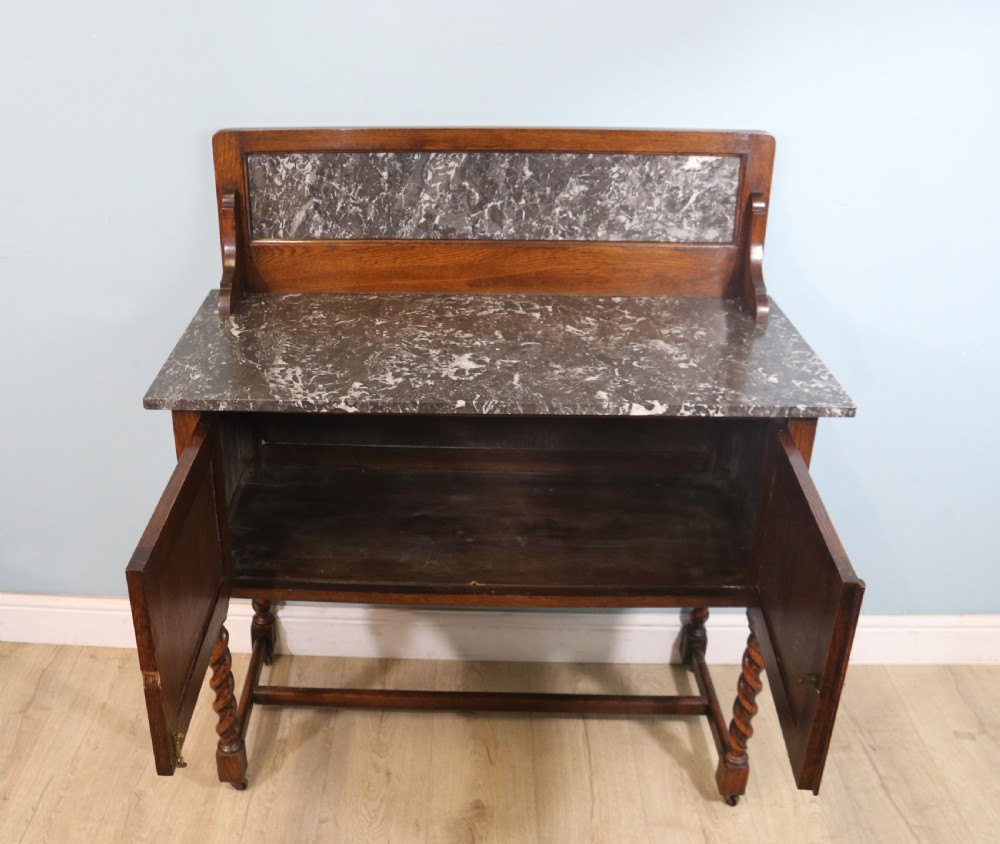 A lovely early 20th Century marble topped oak washstand. View VII