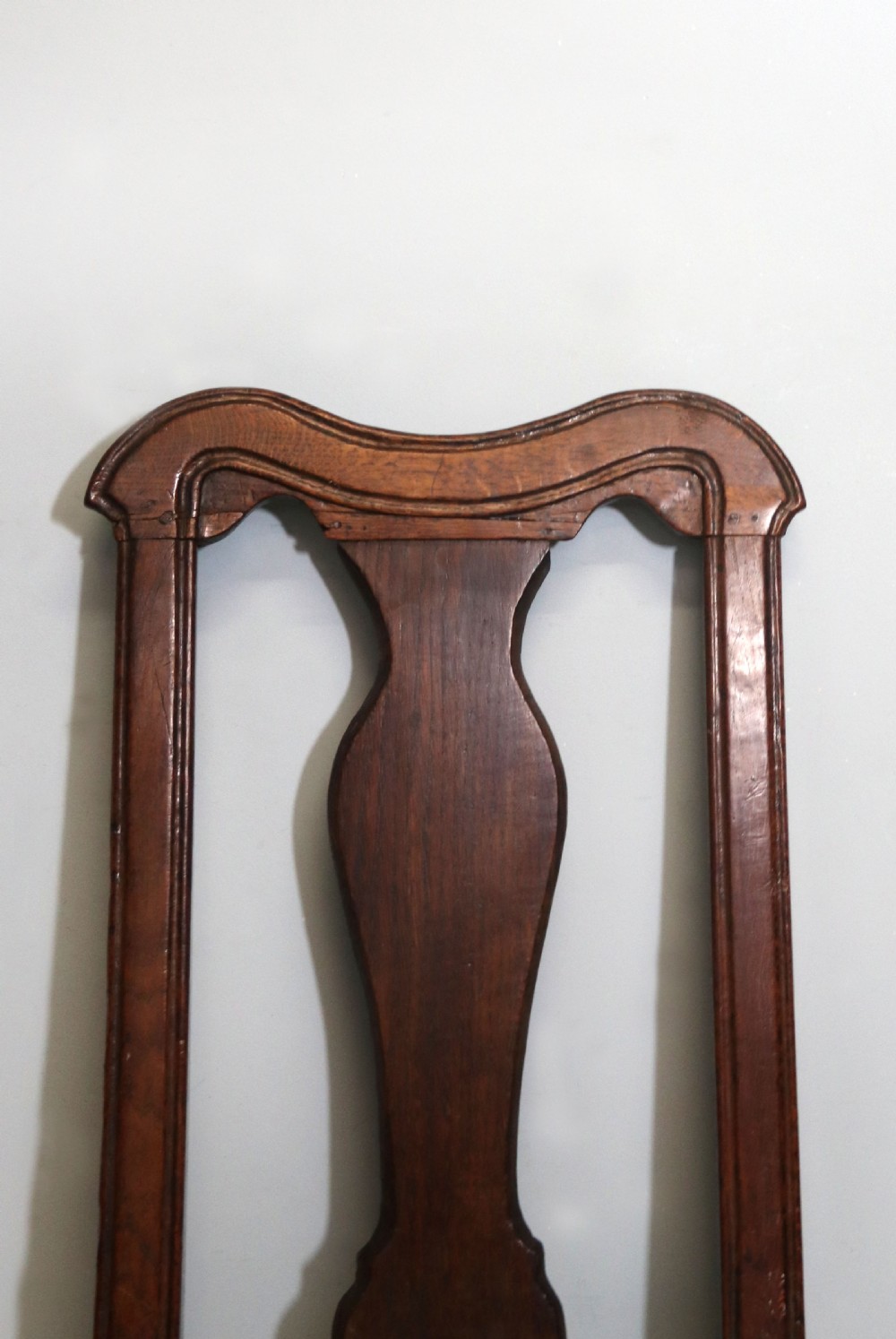 A pair of dark oak side chairs featuring vasiform back splats, turned front stretchers, and seats upholstered in an American flag pattern fabric. View XIII