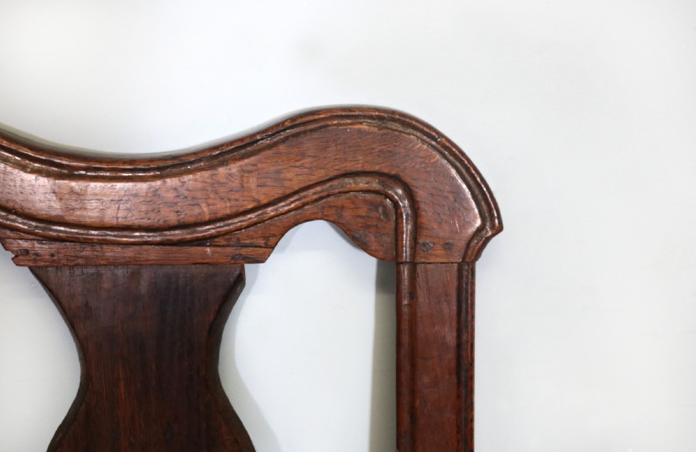 A pair of dark oak side chairs featuring vasiform back splats, turned front stretchers, and seats upholstered in an American flag pattern fabric. View XIV