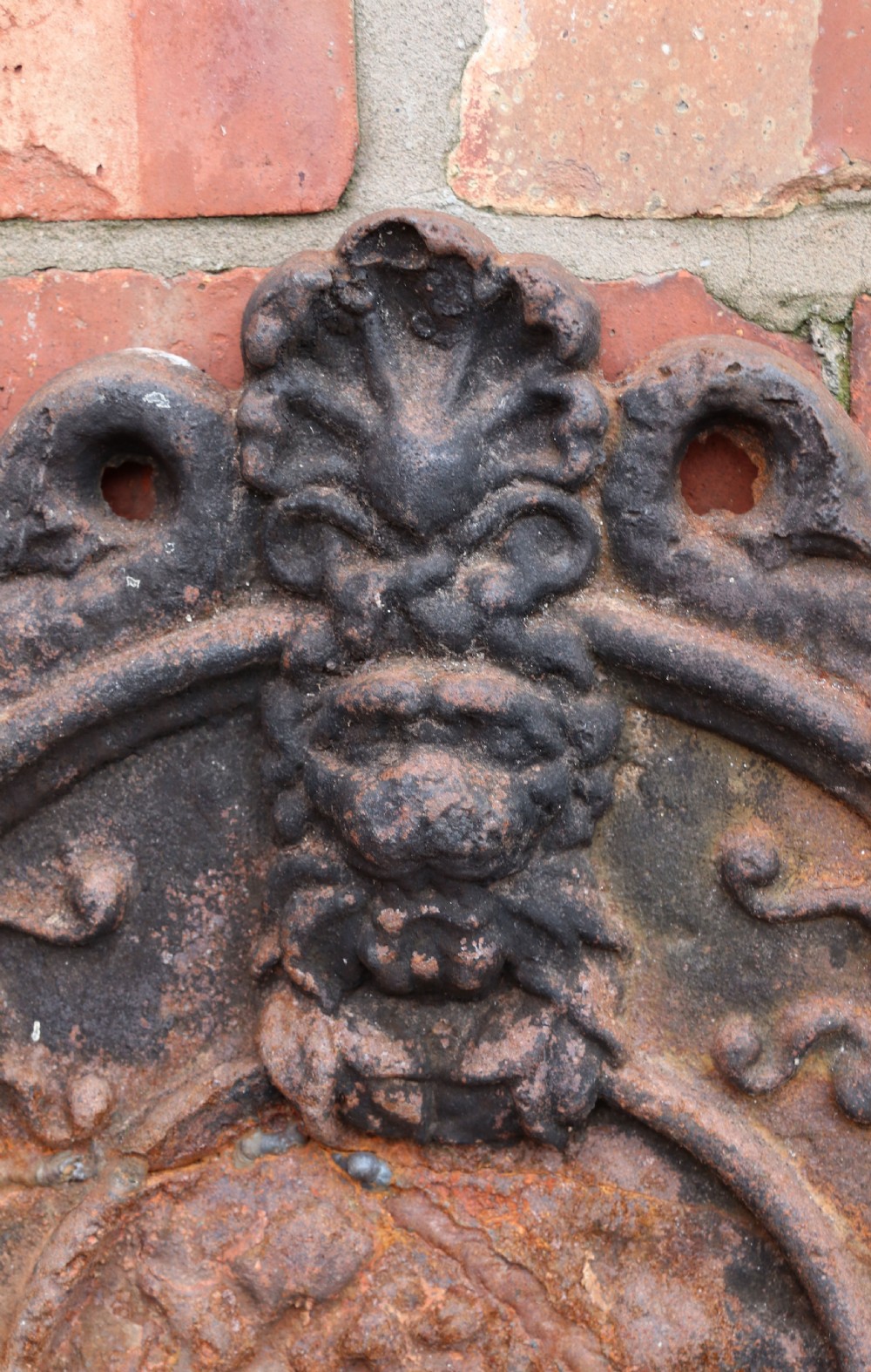 A quality cast iron arch top fireback View VI
