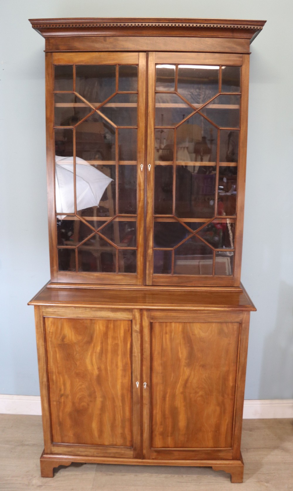A superb example of a quality Georgian mahogany bookcase cabinet.  View II