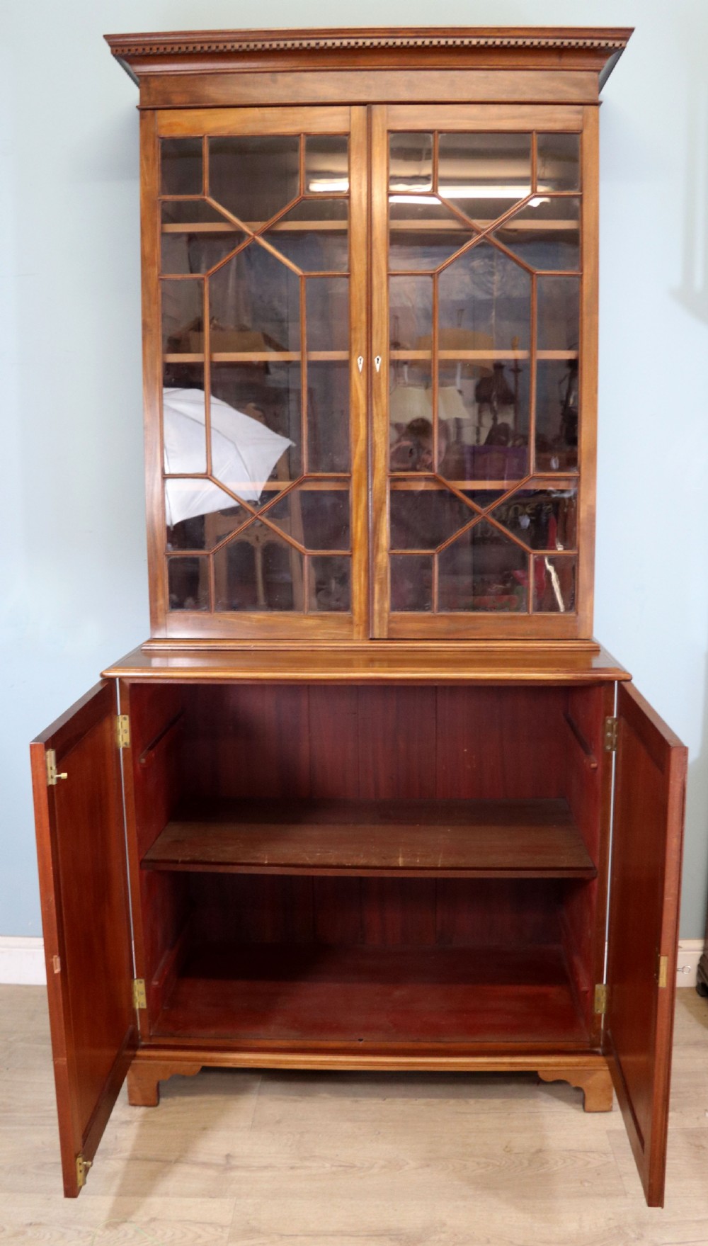 A superb example of a quality Georgian mahogany bookcase cabinet.  View IV