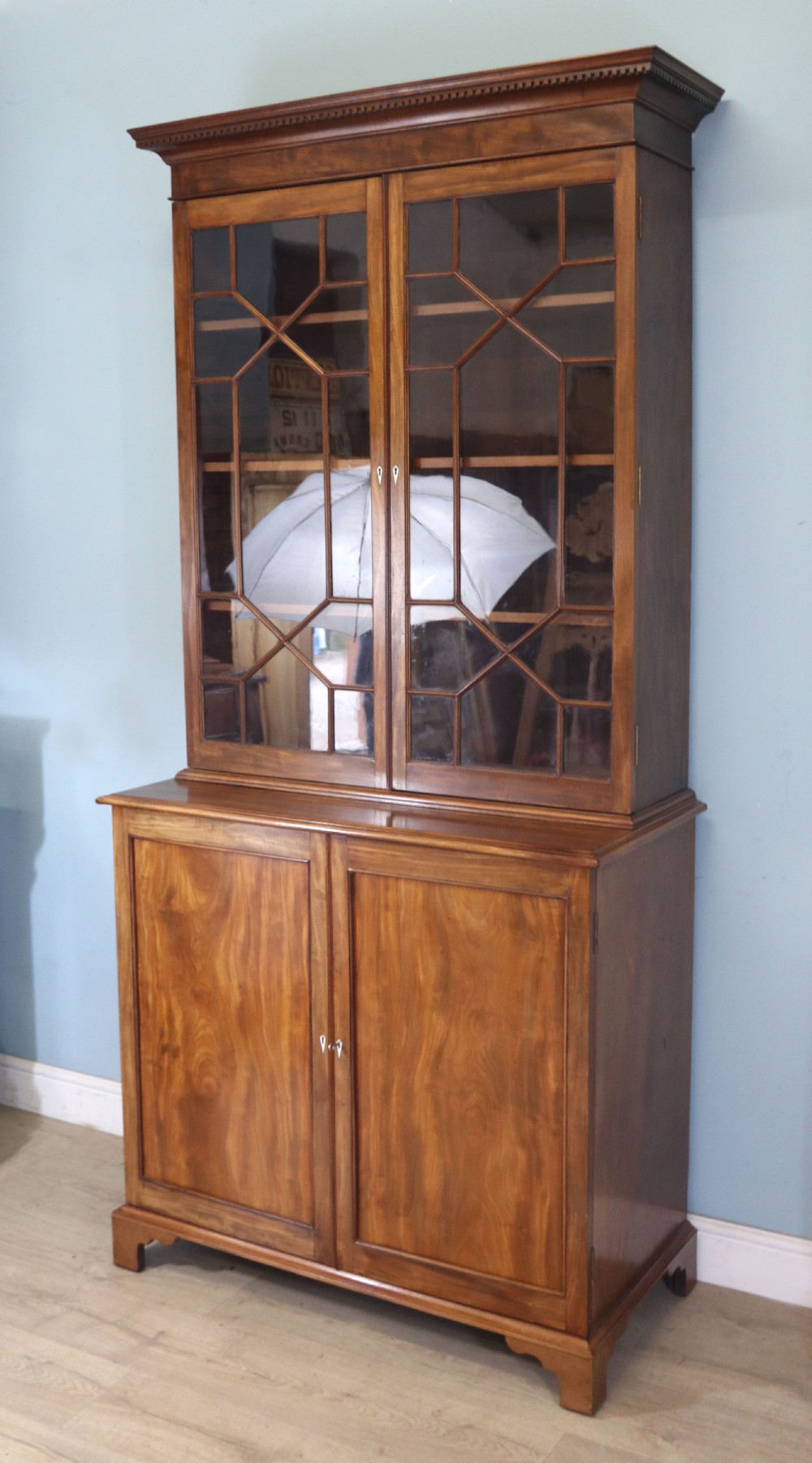 A superb example of a quality Georgian mahogany bookcase cabinet.  View V