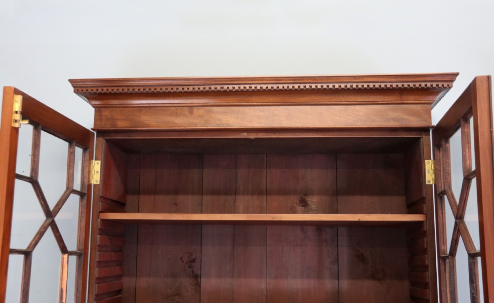 A superb example of a quality Georgian mahogany bookcase cabinet.  View VIII