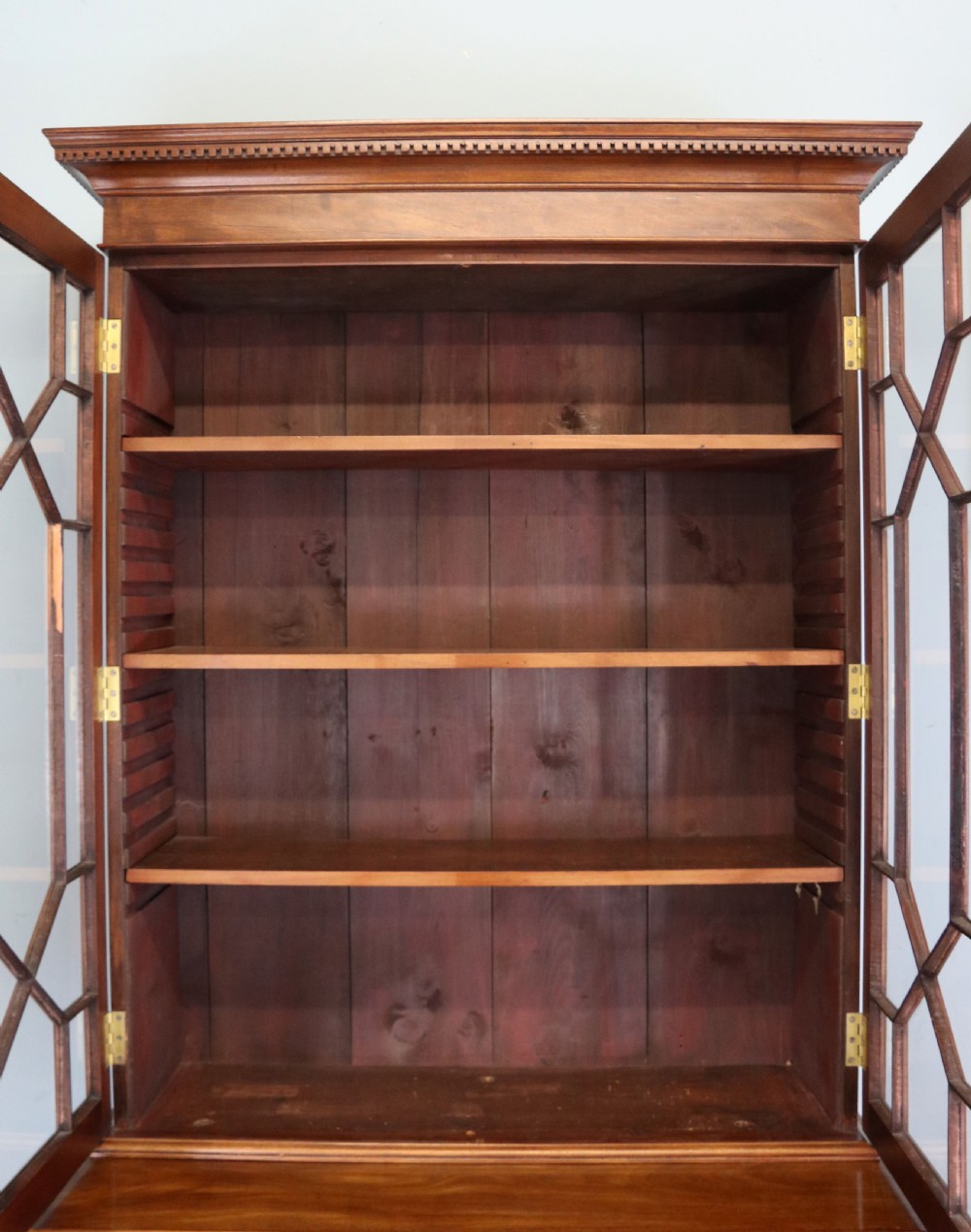 A superb example of a quality Georgian mahogany bookcase cabinet.  View IX