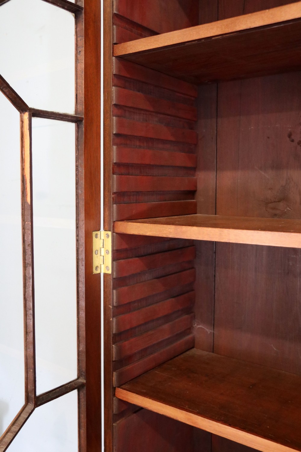 A superb example of a quality Georgian mahogany bookcase cabinet.  View XI