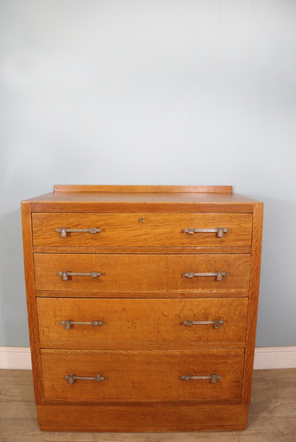 A stylish Heals style four drawer chest of drawers 