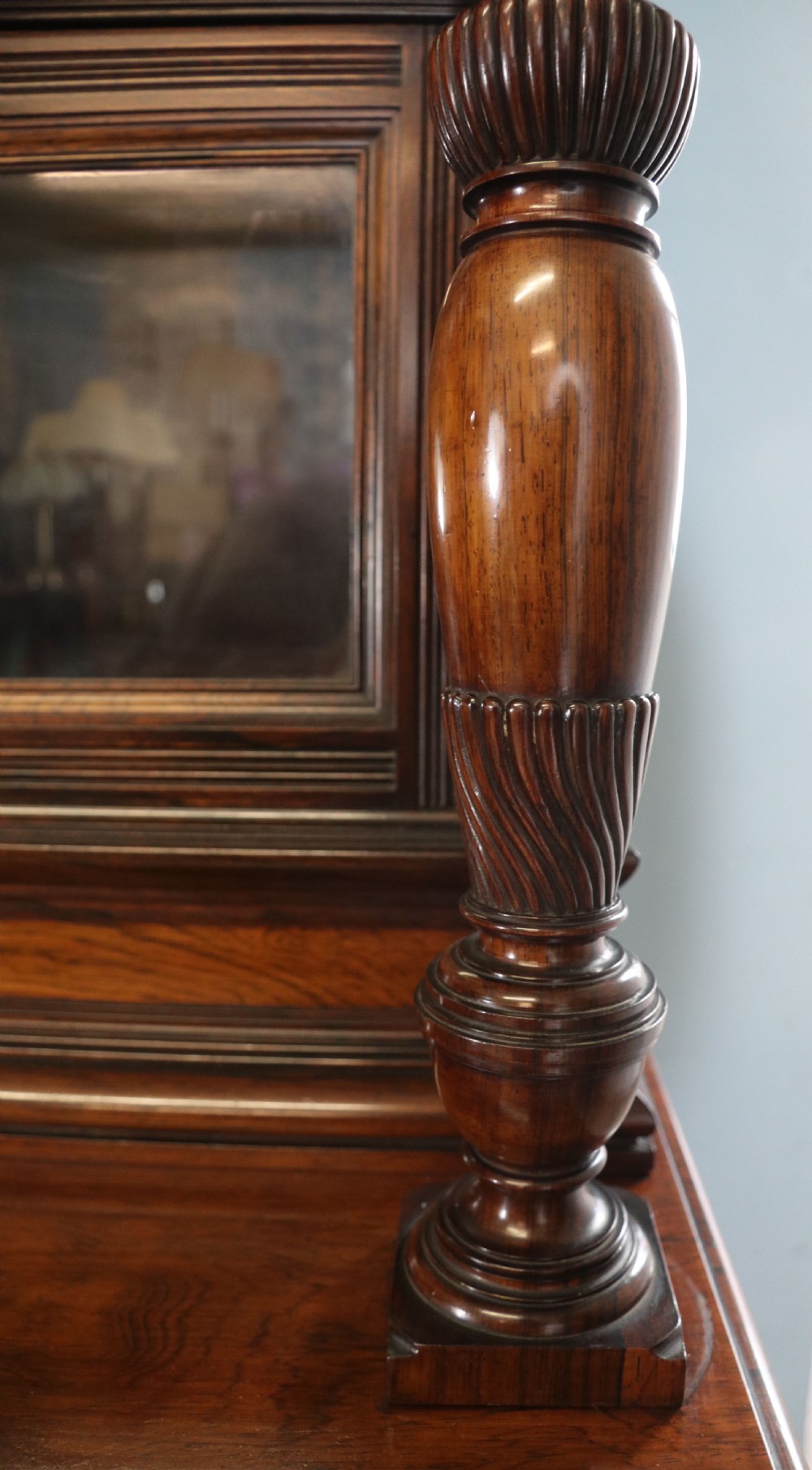 A large Victorian rosewood sideboard featuring an upper tier with arched alcoves, mirrors, and glazed cabinets over a lower base with drawers and panelled doors. View IX