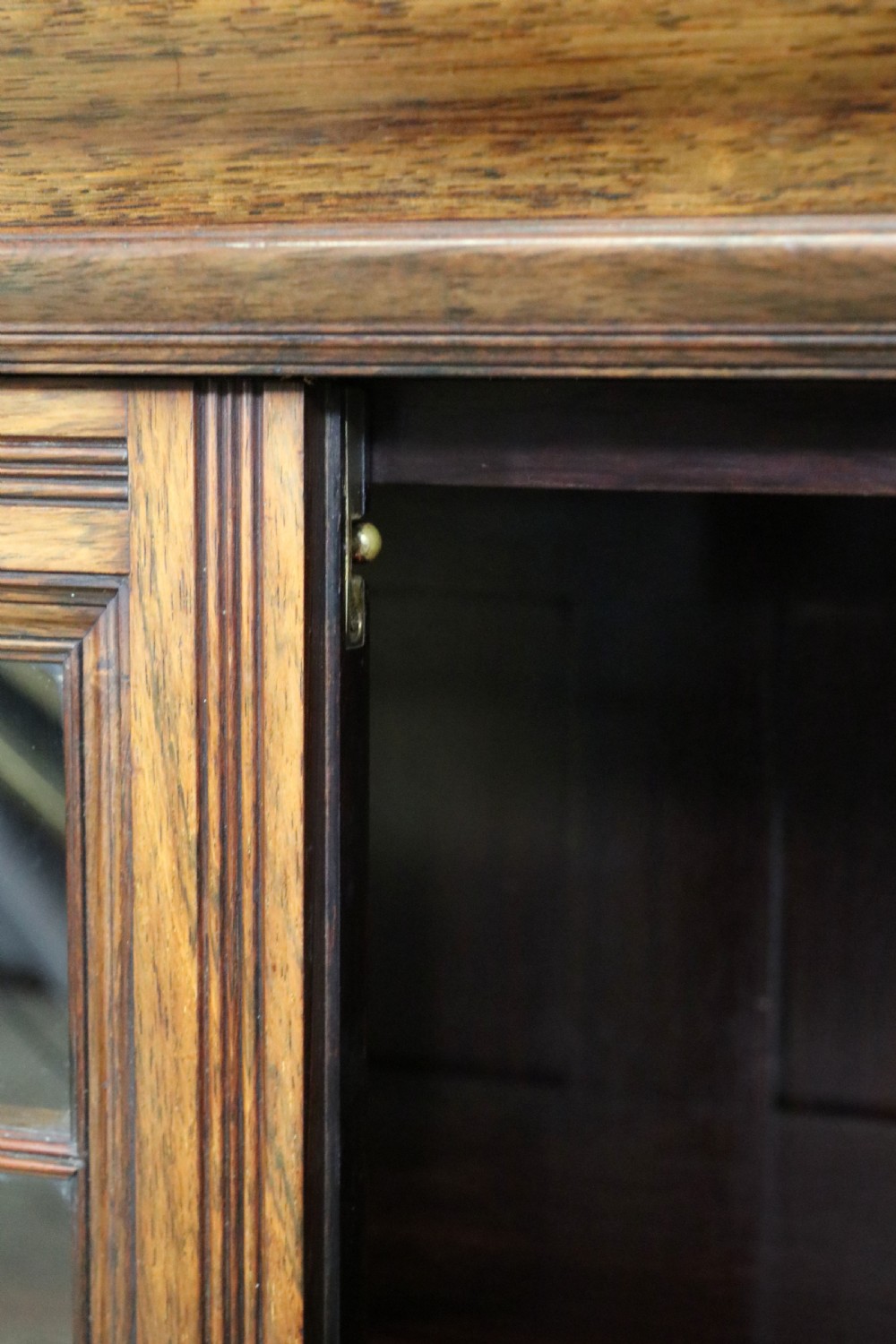 A large Victorian rosewood sideboard featuring an upper tier with arched alcoves, mirrors, and glazed cabinets over a lower base with drawers and panelled doors. View XXV