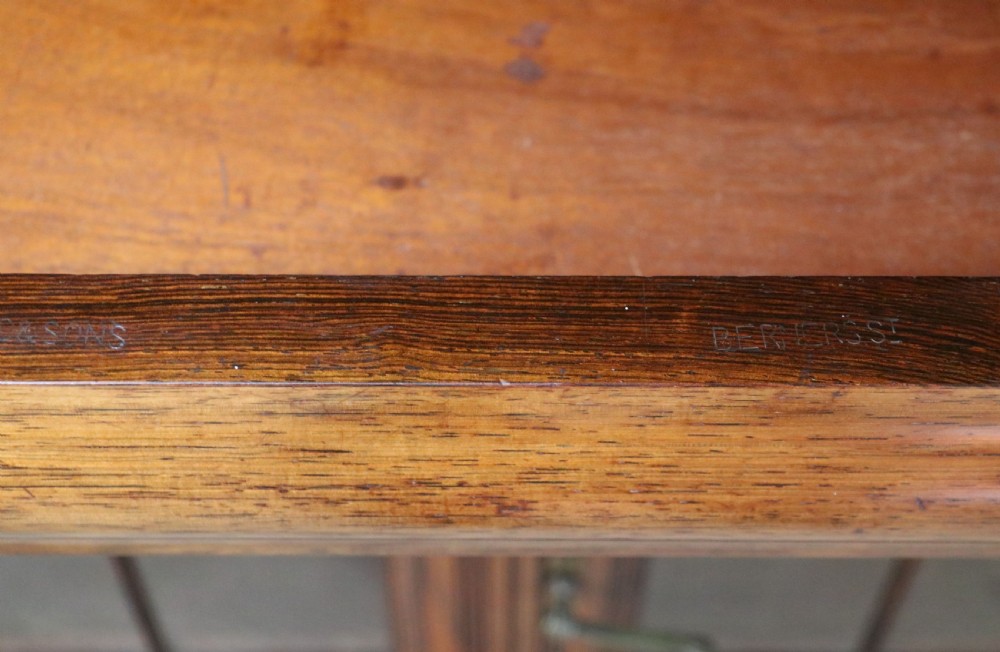 A large Victorian rosewood sideboard featuring an upper tier with arched alcoves, mirrors, and glazed cabinets over a lower base with drawers and panelled doors. View XXX