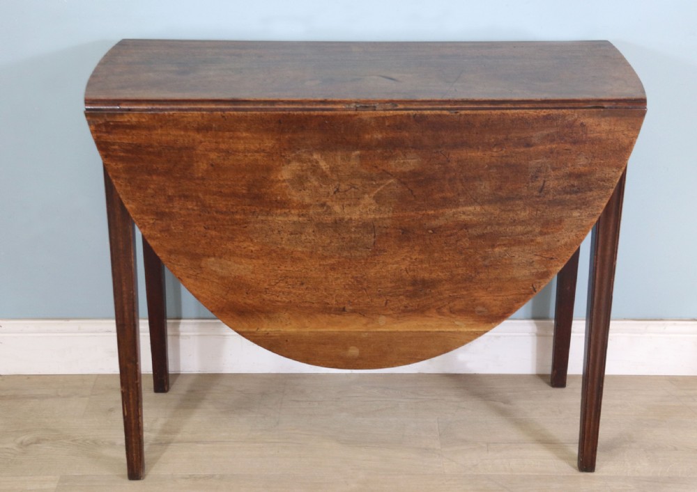 George III mahogany dropleaf table of oval form View II
