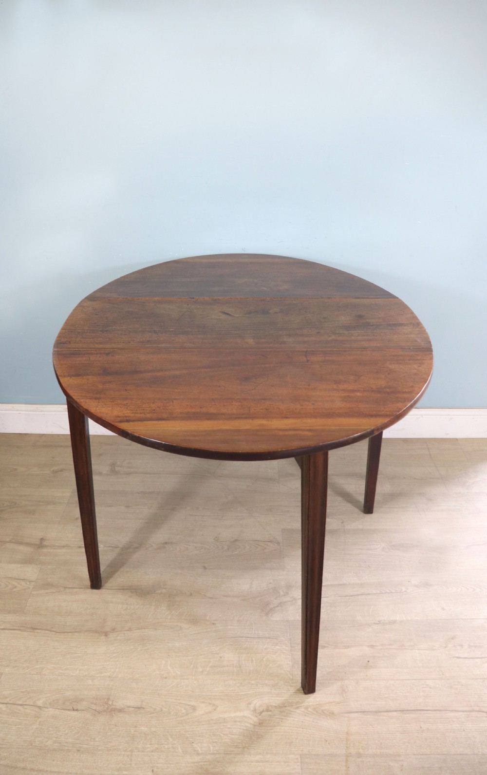 George III mahogany dropleaf table of oval form View III