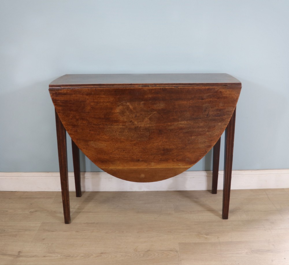 George III mahogany dropleaf table of oval form View V
