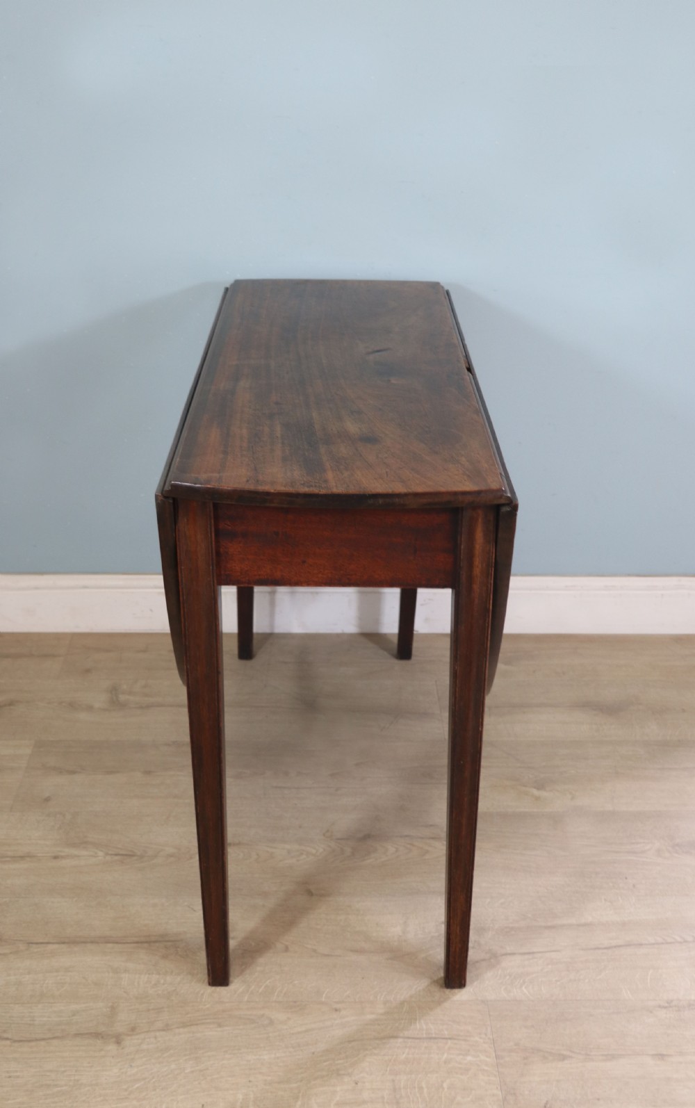 George III mahogany dropleaf table of oval form View XI