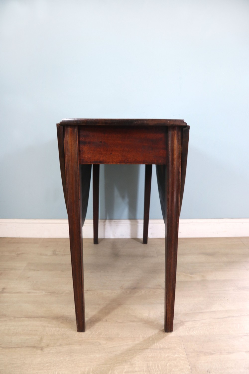 George III mahogany dropleaf table of oval form View XII