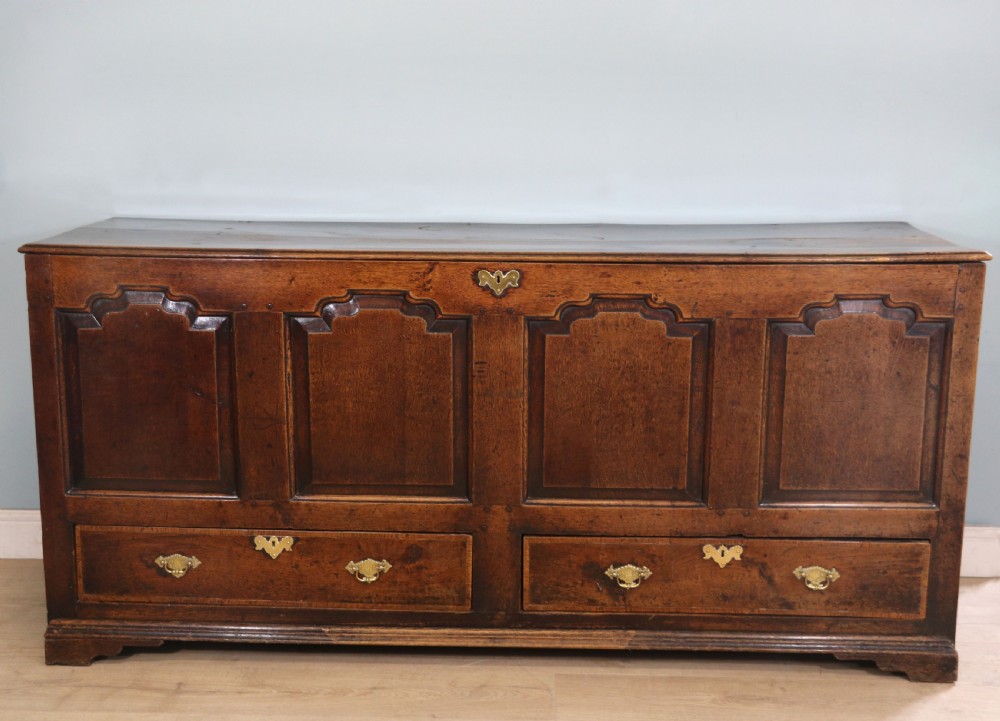 A very fine 18th century oak mule chest View II