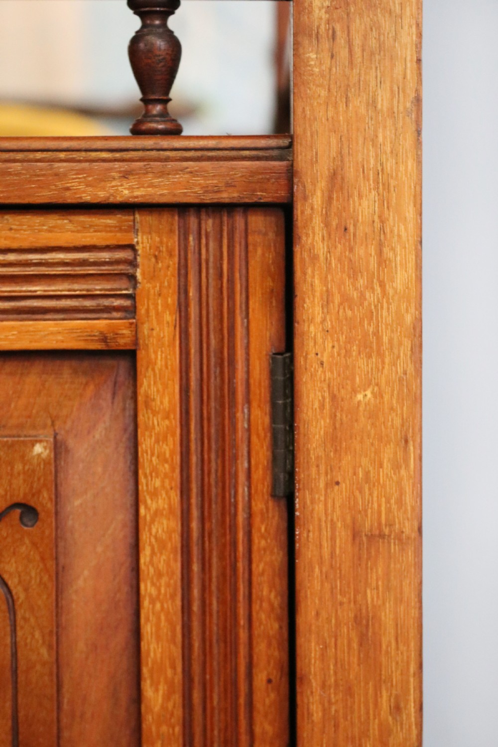 A late Victorian carved wood side cabinet featuring an ornate upper tier with multiple bevelled mirror plates, spindled galleries, glass-front doors, and carved lower cupboards. View VIII