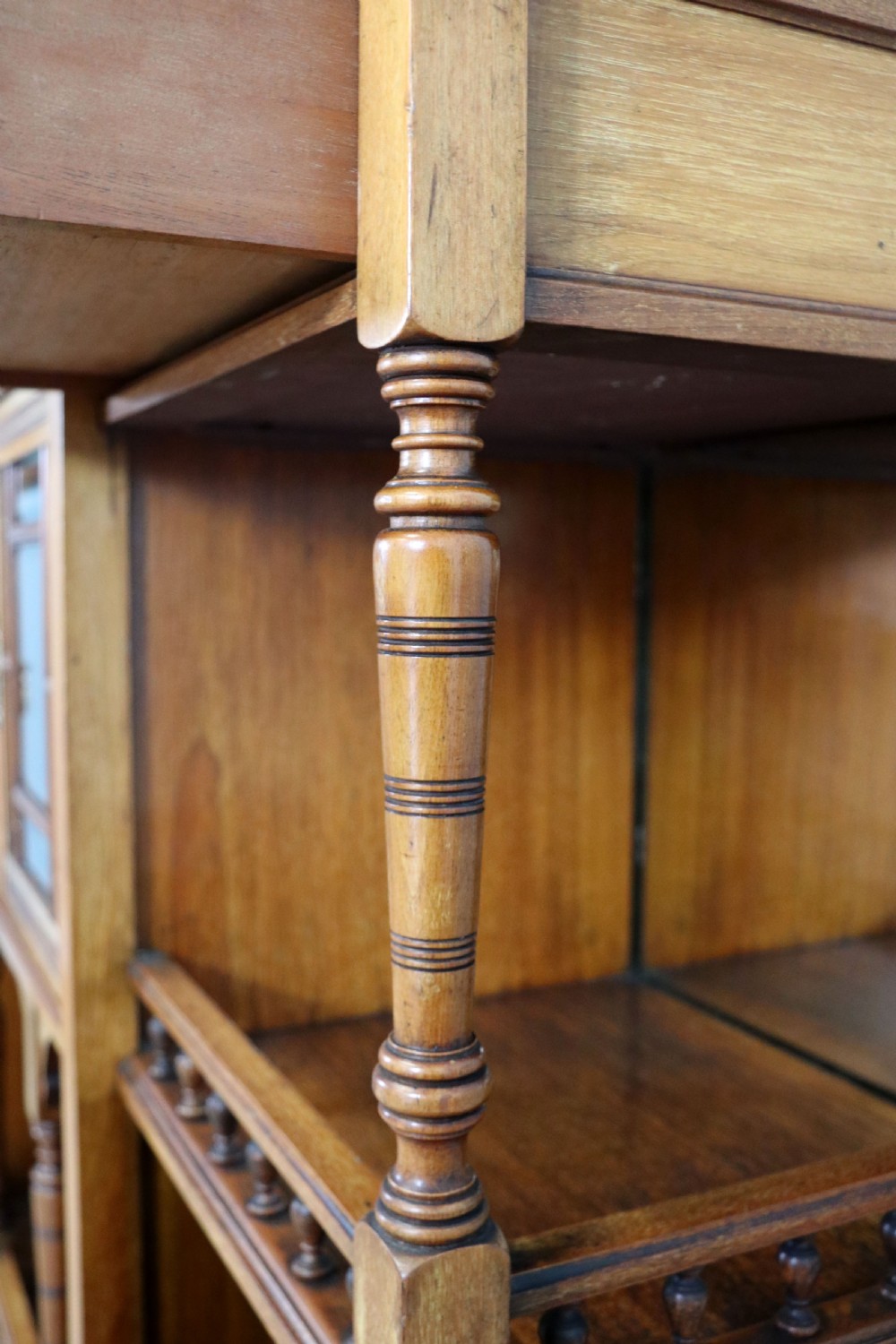 A late Victorian carved wood side cabinet featuring an ornate upper tier with multiple bevelled mirror plates, spindled galleries, glass-front doors, and carved lower cupboards. View XVIII