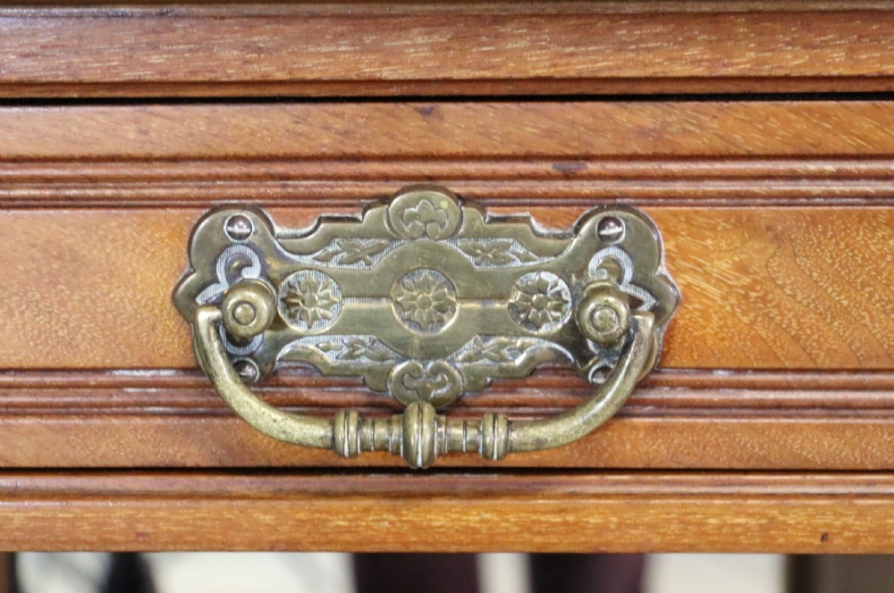 A late Victorian carved wood side cabinet featuring an ornate upper tier with multiple bevelled mirror plates, spindled galleries, glass-front doors, and carved lower cupboards. View XXVI