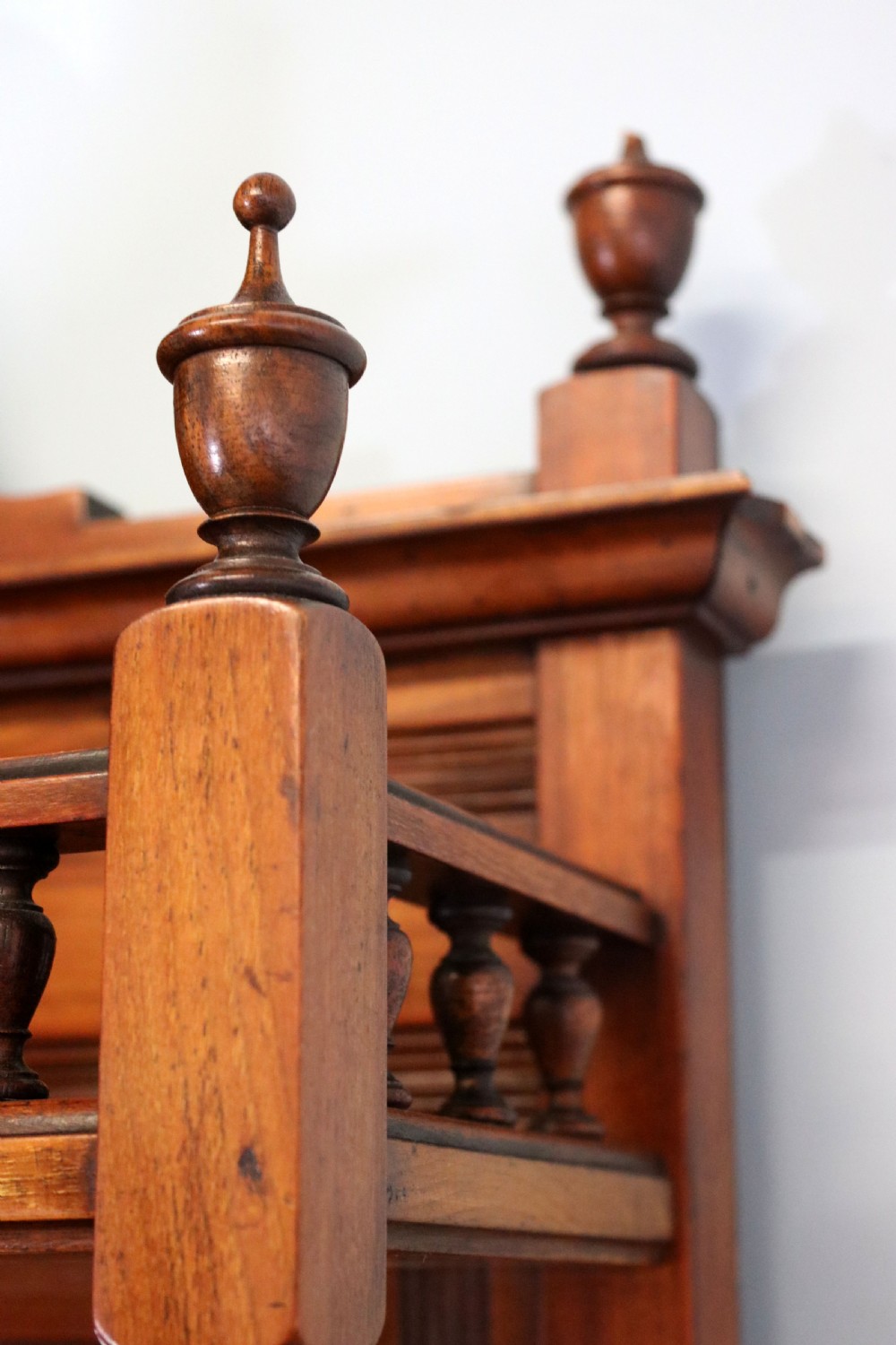 A late Victorian carved wood side cabinet featuring an ornate upper tier with multiple bevelled mirror plates, spindled galleries, glass-front doors, and carved lower cupboards. View XXVII