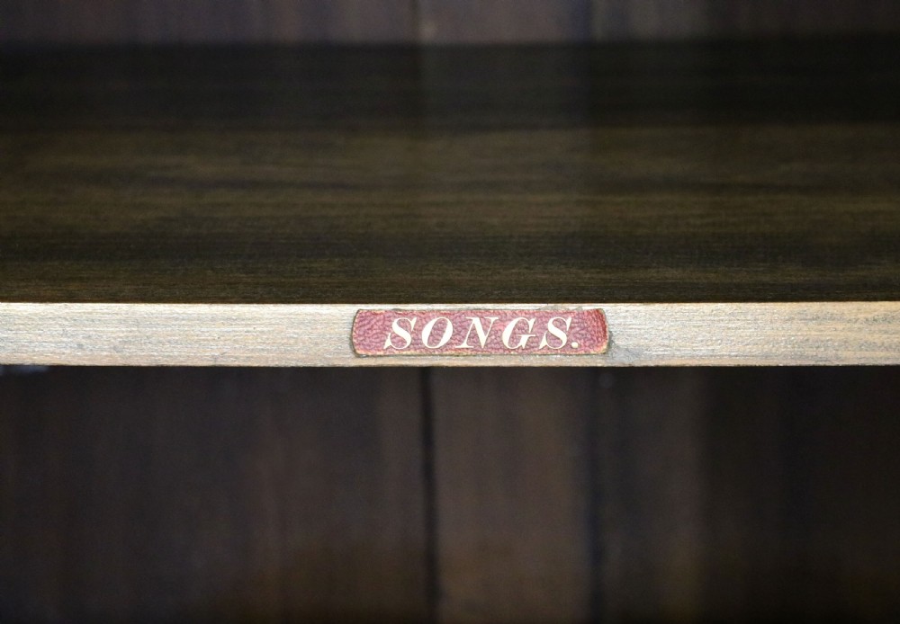  Late 19th century American walnut music cabinet. View XVI
