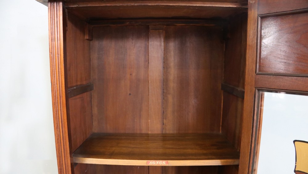  Late 19th century American walnut music cabinet. View XVIII
