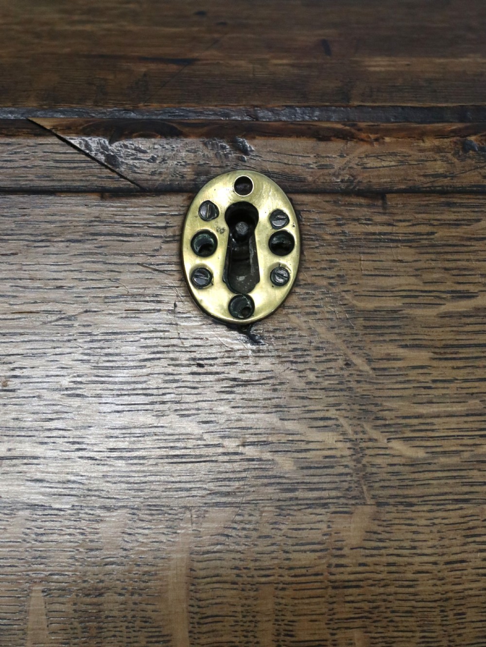 An open George III oak bureau featuring mahogany crossbanding, brass swan-neck handles, pull-out lopers, and a fitted interior with pigeonholes. View XIII