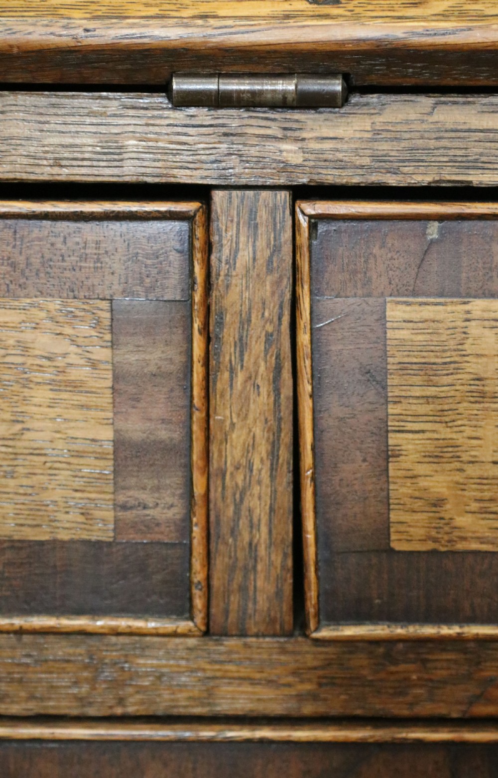 An open George III oak bureau featuring mahogany crossbanding, brass swan-neck handles, pull-out lopers, and a fitted interior with pigeonholes. View XIX