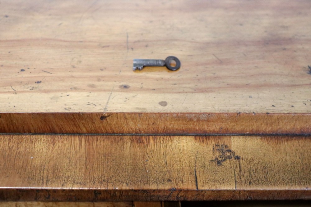 A Victorian light wood chest of drawers with two short drawers over three long drawers, featuring carved leaf handles and a solid plinth base. View XVIII
