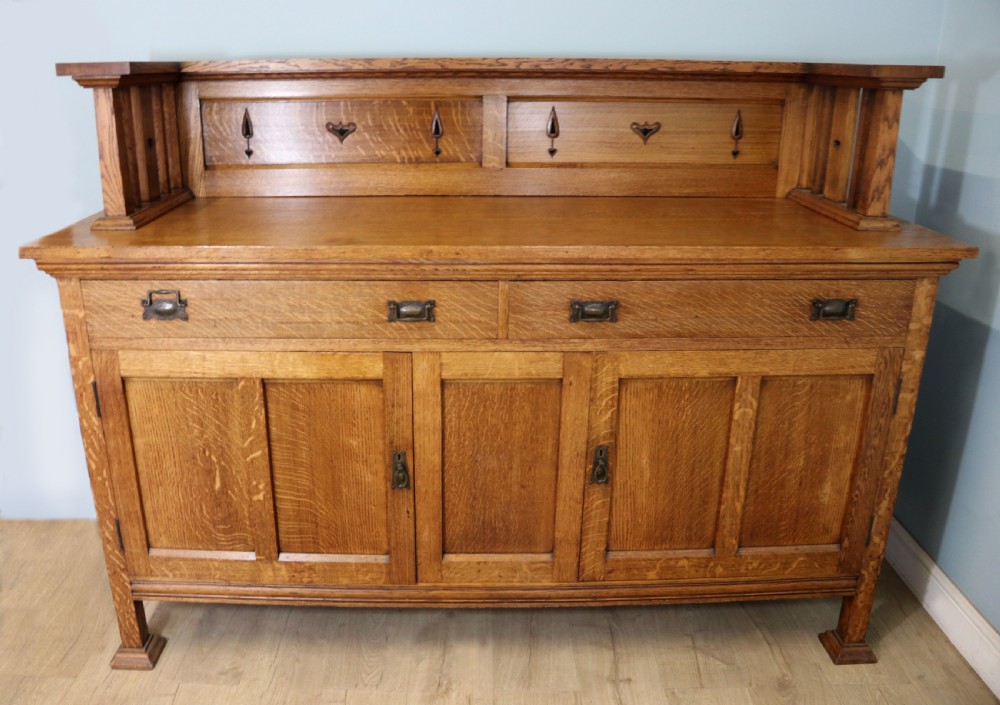 A lovely late Victorian solid light oak sideboard 