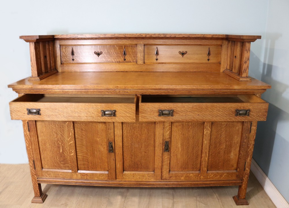 A lovely late Victorian solid light oak sideboard  View II
