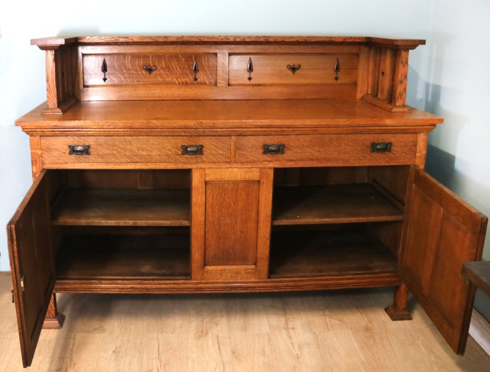 A lovely late Victorian solid light oak sideboard  View III