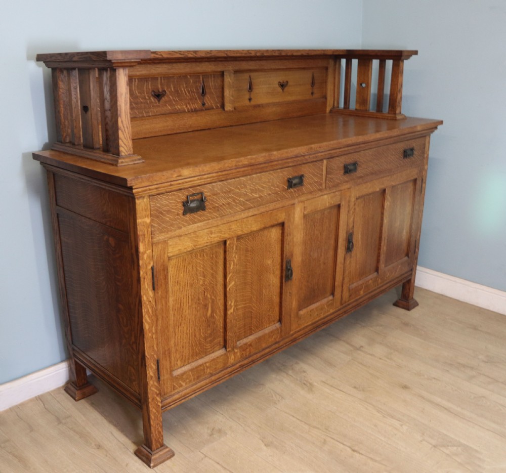 A lovely late Victorian solid light oak sideboard  View IV