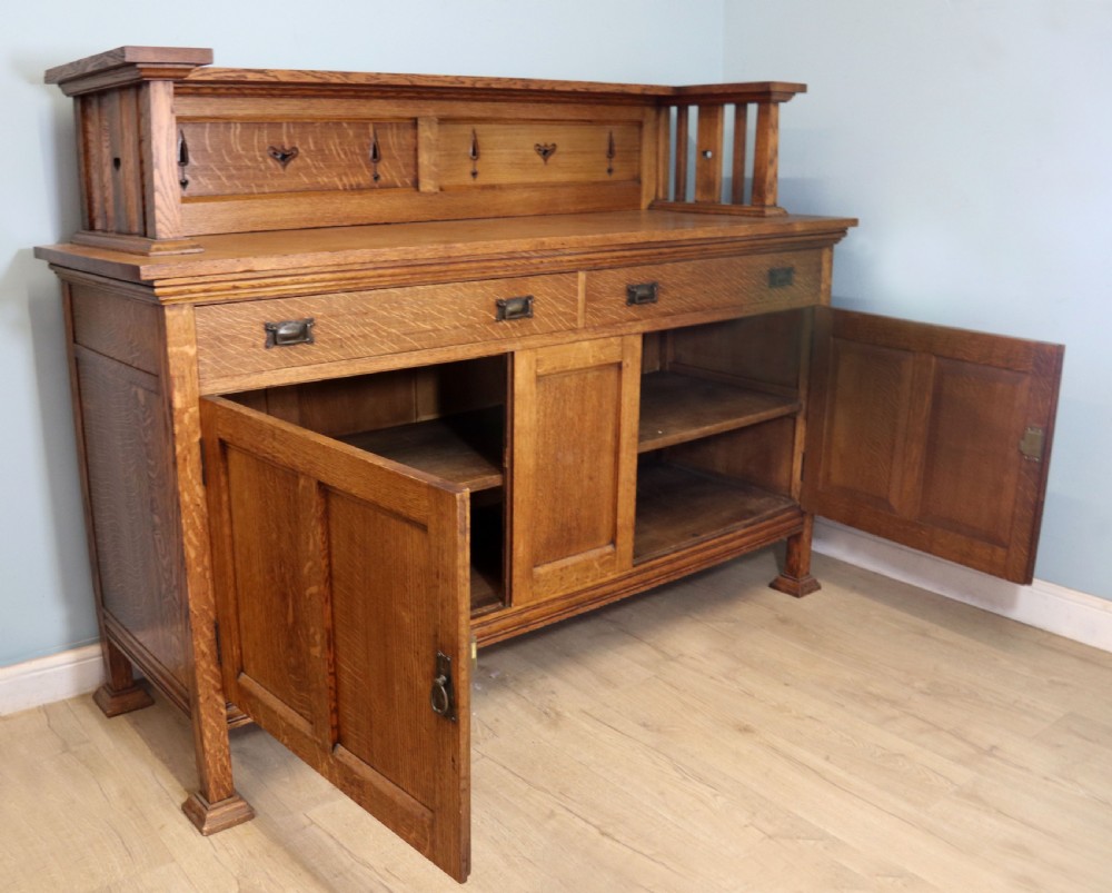 A lovely late Victorian solid light oak sideboard  View VI