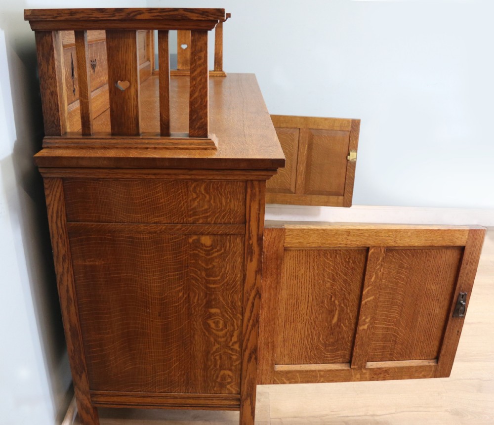 A lovely late Victorian solid light oak sideboard  View IX
