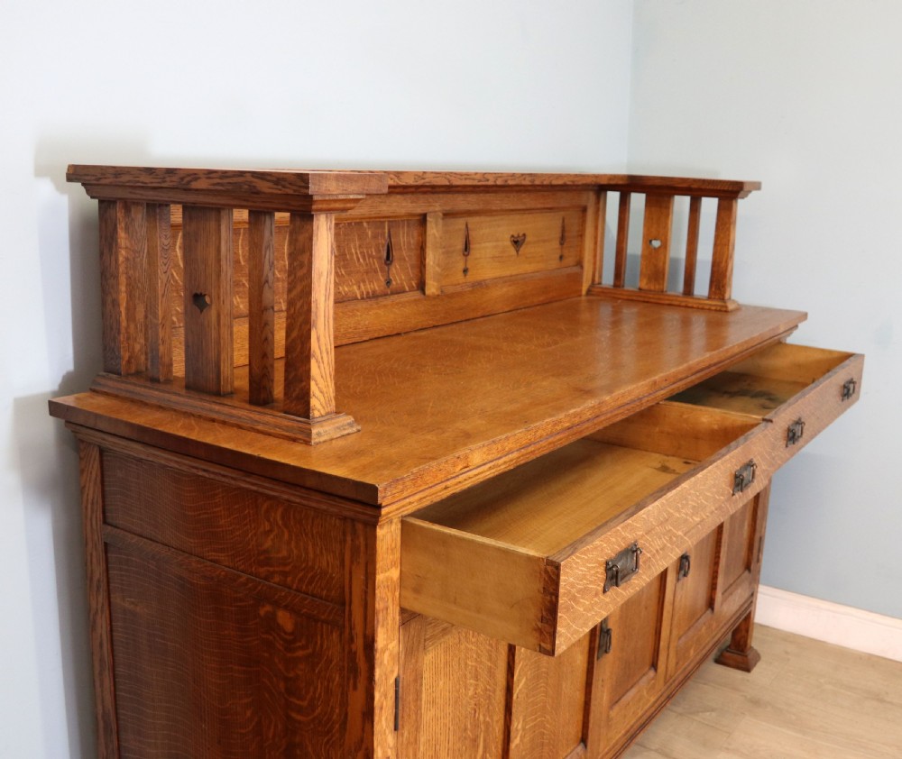 A lovely late Victorian solid light oak sideboard  View X