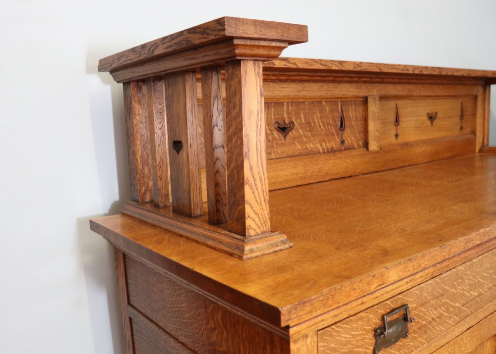 A lovely late Victorian solid light oak sideboard  View XIV