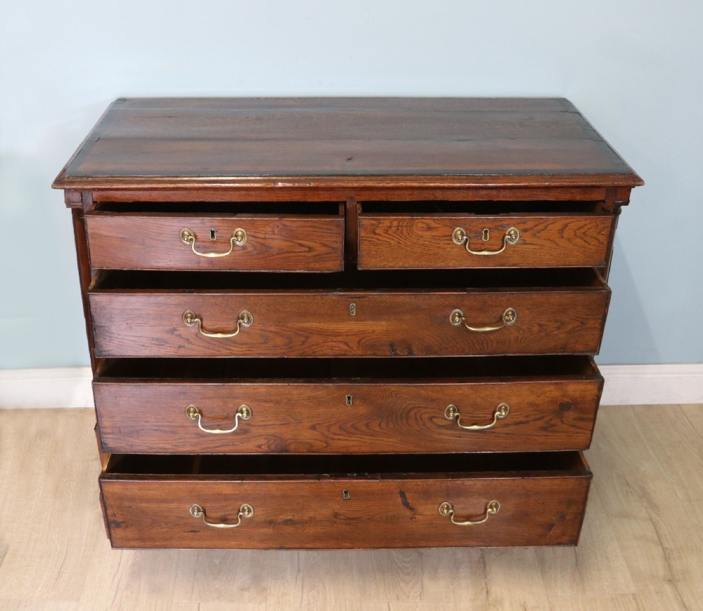 A lovely George III oak and mahogany crossbanded chest View II