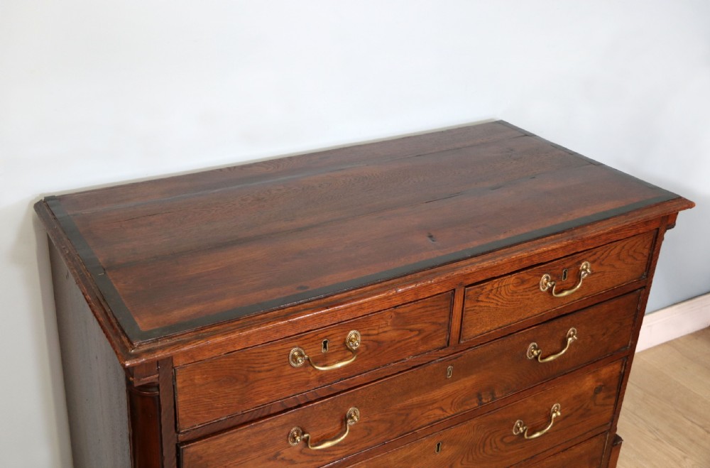 A lovely George III oak and mahogany crossbanded chest View VI
