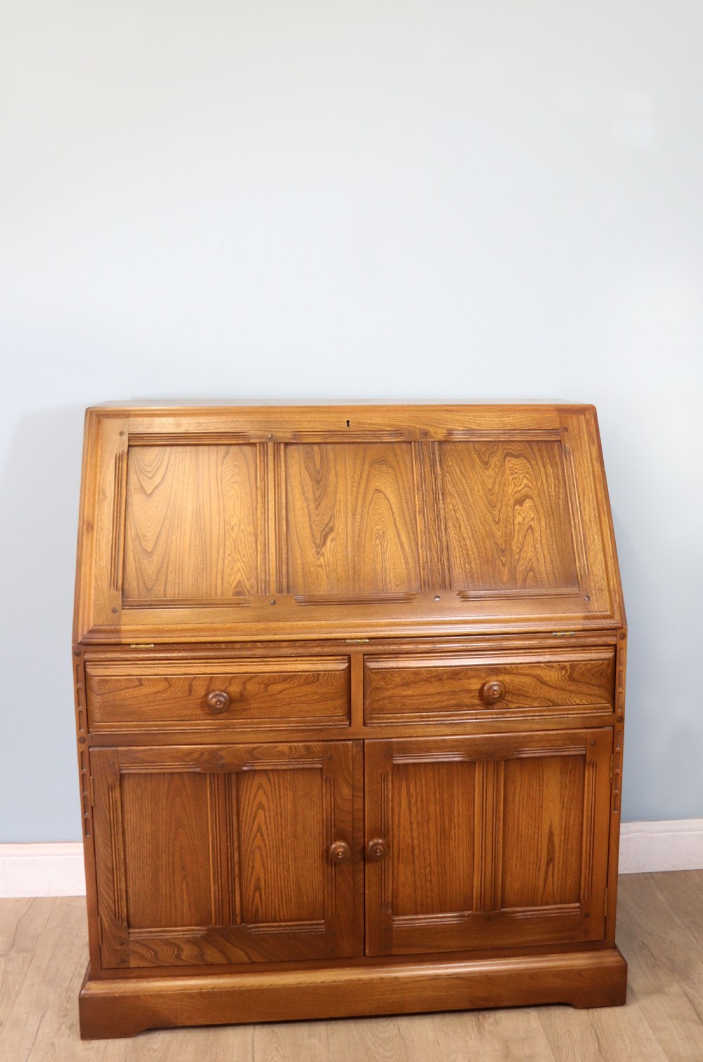  A lovely piece of modern Ercol light elm bureau. View II
