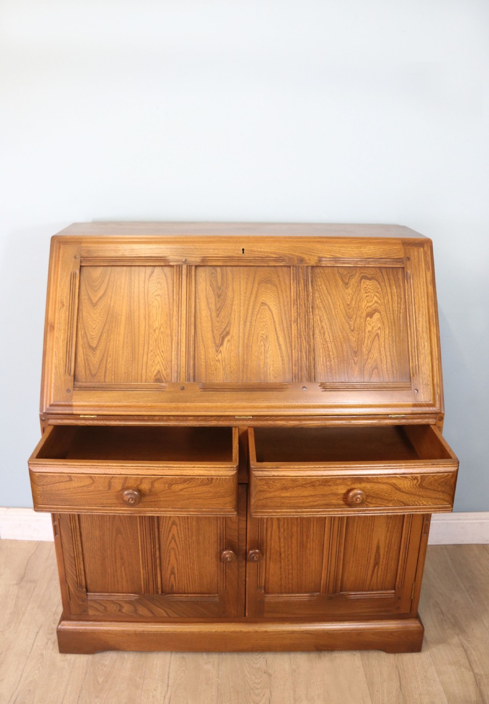  A lovely piece of modern Ercol light elm bureau. View IV
