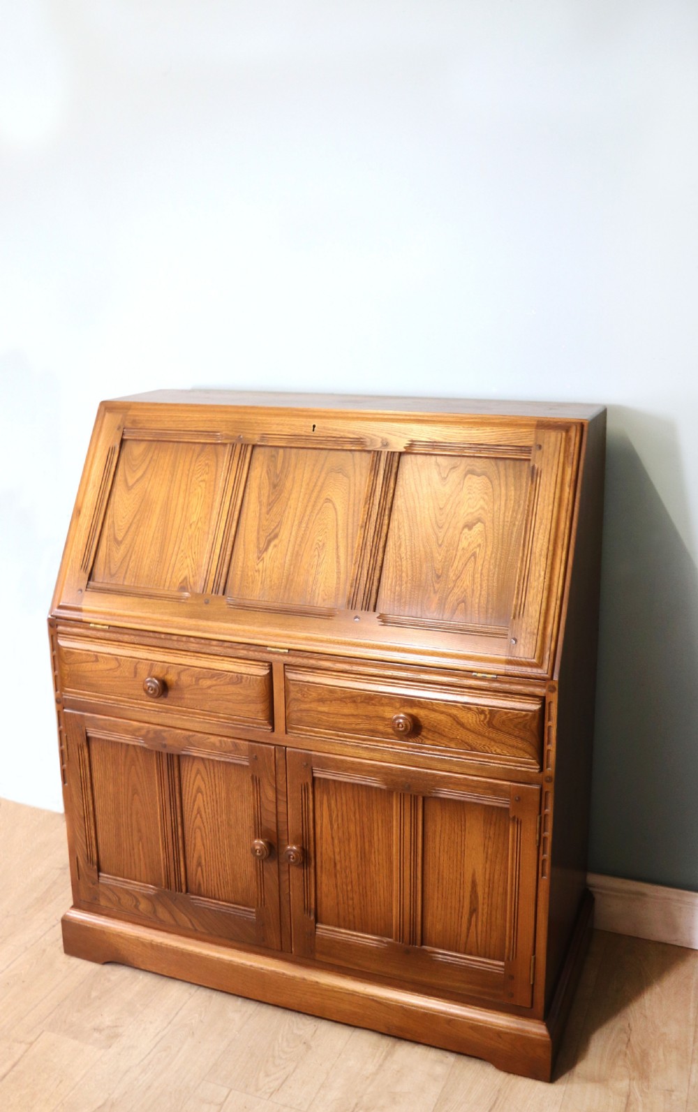  A lovely piece of modern Ercol light elm bureau. View VI