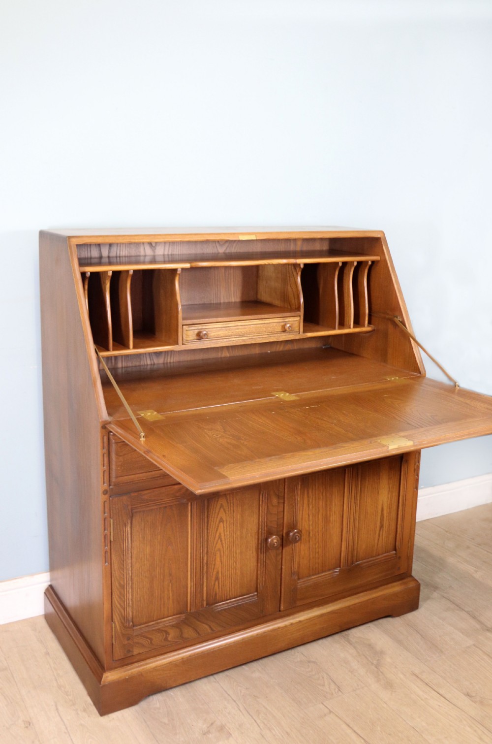  A lovely piece of modern Ercol light elm bureau. View VII