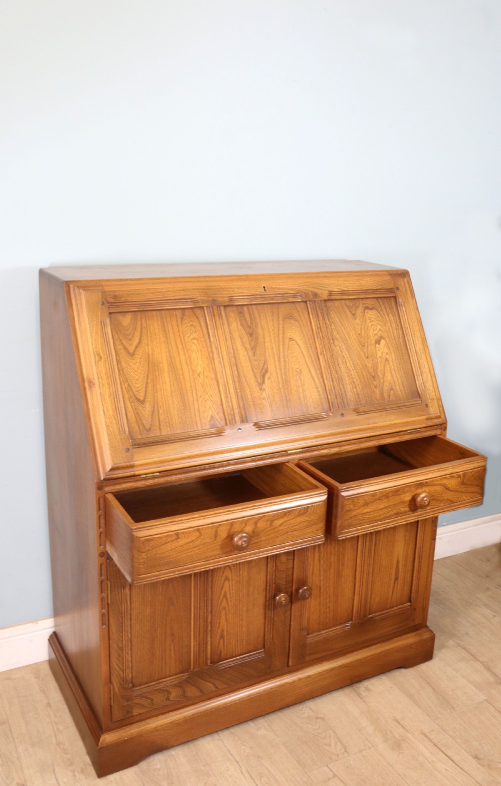  A lovely piece of modern Ercol light elm bureau. View VIII