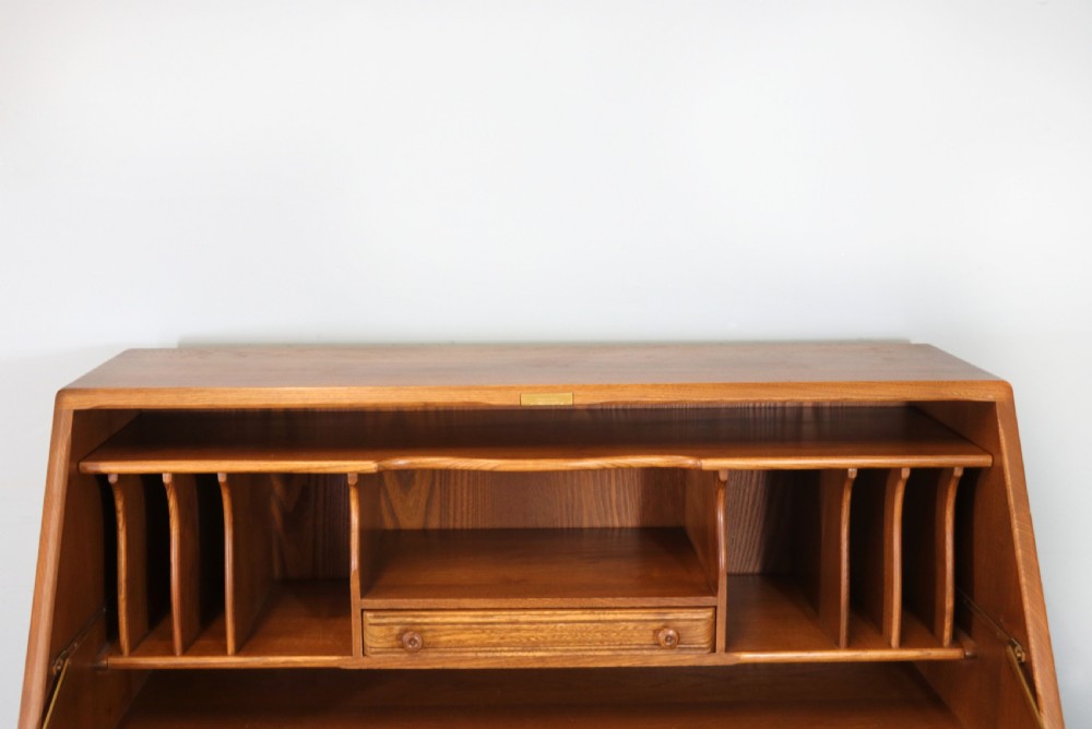  A lovely piece of modern Ercol light elm bureau. View XII